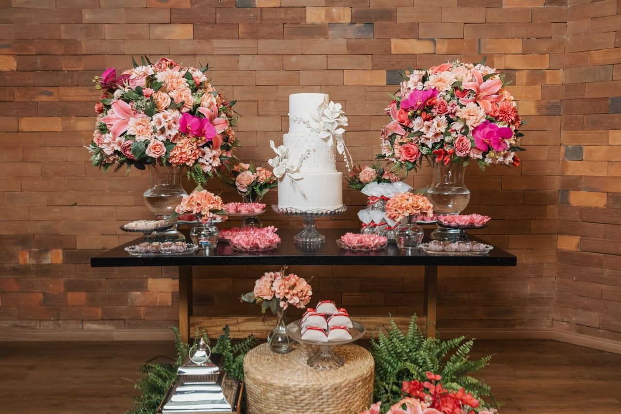 Crafting Captivating Headlines: Your awesome post title goes here Luxurious wedding cake display with lush floral arrangements in a rustic setting.
